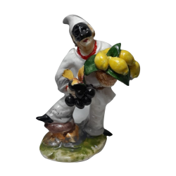 pulcinella con ceste di uva e limoni